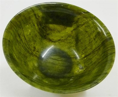 Lot 225 - A Chinese Green Jade-Type Bowl, 20th century, of circular form and ogee outline, 4.8cm high,...