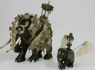 Lot 227 - An Indian Carved Ebony, White Metal Mounted and Gem Set Caparisoned Elephant, probably early...