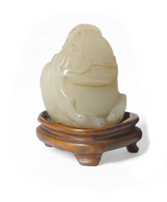 Lot 230 - A Chinese Carved Pale Celadon Jade-Type Fruit and Leaf Ornament, late Qing Dynasty, as a large...
