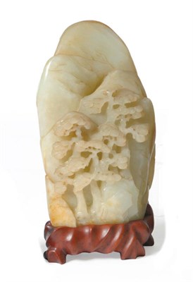 Lot 231 - A Chinese Pale Celadon Jade-Type Boulder Carving, late Qing Dynasty, of arched form, deeply...
