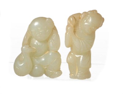 Lot 235 - A Chinese Celadon Jade-Type Carving of a Little Boy, Qing Dynasty, half kneeling, holding millet on