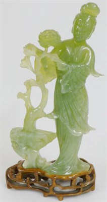 Lot 240 - A Chinese Jadeite-Type Figure of Guanyin, 20th century, the slender goddess with chignon and...