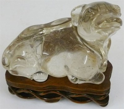 Lot 244 - A Chinese Rock Crystal Recumbent Buffalo, late Qing Dynasty, its head turned to the right and...