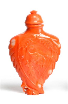 Lot 250 - A Chinese Carved Coral Snuff Bottle, early 20th century, of spade form, in relief with a...