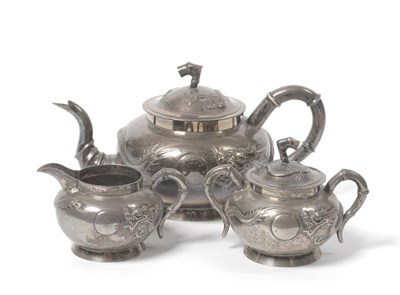 Lot 282 - A Chinese White Metal Three Piece Teaset, Tuckcheng, circa 1890-1900, of spherical form with...