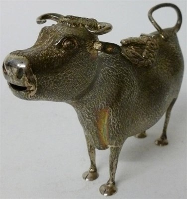 Lot 290 - An Elizabeth II Cow Creamer, PCLd, London 2001, naturalistically modelled as a cow with a fly...