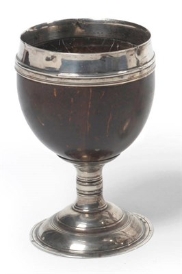 Lot 377 - A George II Silver Mounted Coconut Cup, maker's mark only, John Harvey, London, circa 1740, the...