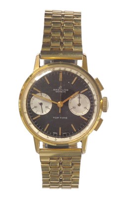 Lot 405 - A Steel and Gilt Chronograph Wristwatch, signed Breitling, Geneve, Model: Top Time, circa 1965,...