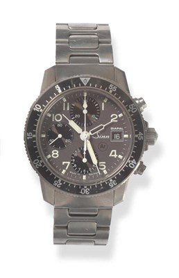 Lot 427 - A Titanium Two Time Zone Automatic Calendar Chronograph Wristwatch, signed Sinn, model series...