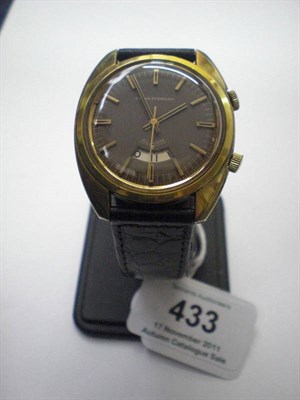 Lot 433 - A Gold Plated Centre Seconds Alarm Wristwatch, signed Girard Perregaux, circa 1970, 17-jewel...