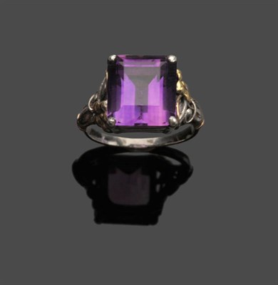 Lot 466 - An Arts and Crafts Amethyst Ring, attributed to Bernard Instone, the step cut amethyst within white