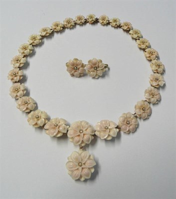 Lot 474 - A Floral Necklace and Brooch Set, the necklace of graduated flowers (probably shell) with a...