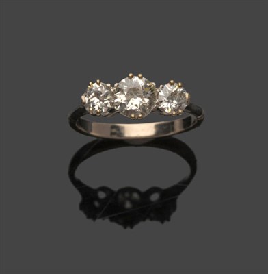 Lot 485 - A Diamond Three Stone Ring, the graduated old brilliant cut diamonds in white claw settings to...