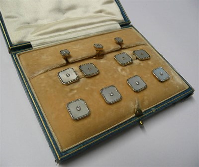 Lot 490 - A Cased Set of Cufflinks and Dress Studs, of octagonal form, a diamond to the centre of a...