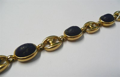 Lot 494 - A Lapis Lazuli Bracelet, cabochon lapis lazuli spaced by anchor links, length 19.2cm