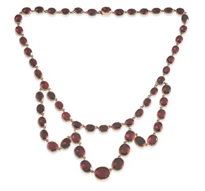 Lot 498 - A Swag Necklace, of foil backed garnets, length 40cm, largest swag drop measures 4.6cm from the...