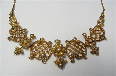 Lot 505 - A Late 19th Century/Early 20th Century Seed Pearl Necklace, scrolling panels with knife wire...