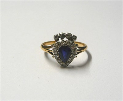 Lot 508 - A Victorian Sapphire and Diamond Cluster Ring, a sapphire within a border of old cut diamonds...