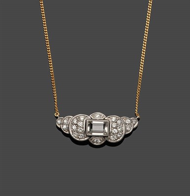 Lot 511 - A Diamond Necklace, a central scalloped panel set with a baguette cut diamond within round...