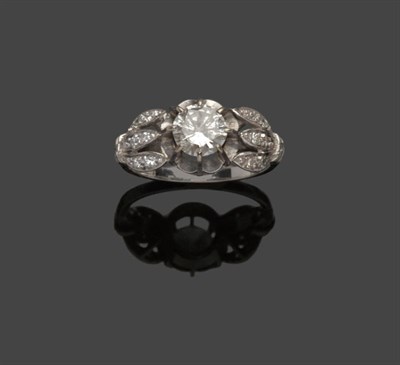 Lot 514 - A Diamond Solitaire Ring, a round brilliant cut diamond in a white eight claw setting to...