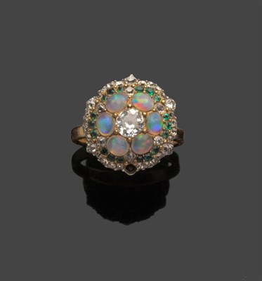 Lot 515 - A Diamond, Opal and Emerald Cluster Ring, an old cut diamond within a border of oval cabochon opals