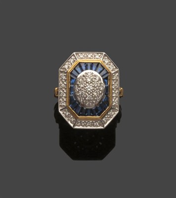 Lot 517 - An 18 Carat Gold Art Deco Style Diamond and Sapphire Cluster Ring, pavé set diamonds within a...