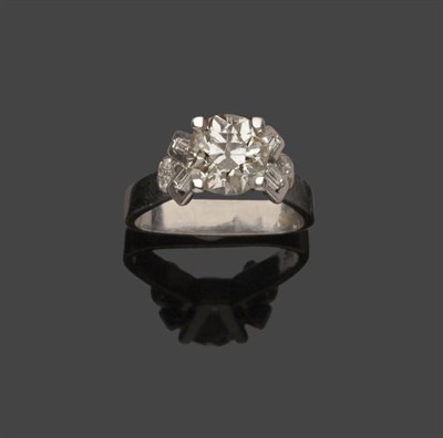 Lot 519 - A Diamond Solitaire Ring, a round brilliant cut diamond in a white four claw setting to...