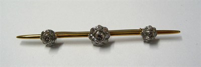 Lot 522 - A Diamond Bar Brooch, set with three graduated round brilliant cut diamond clusters at...