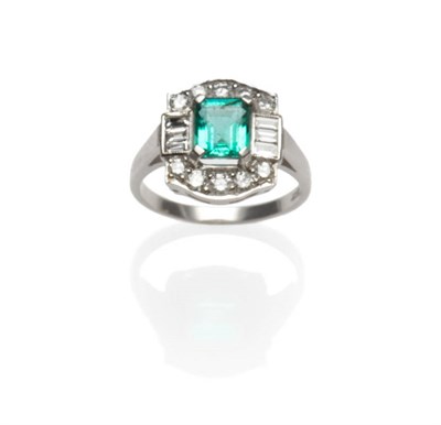 Lot 530 - An Art Deco Style Emerald and Diamond Ring, the step cut emerald in a white claw setting within...