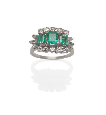 Lot 538 - An Emerald and Diamond Cluster Ring, three step cut emeralds within a border of round brilliant cut