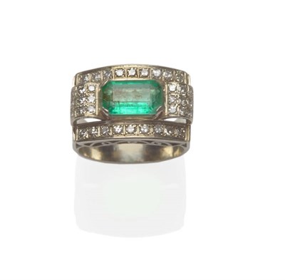 Lot 539 - An Emerald and Diamond Cluster Ring, the emerald-cut emerald claw set within a border of...