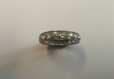 Lot 554 - A Diamond Full Eternity Ring, old cut diamonds claw set within an engraved flat sided band,...