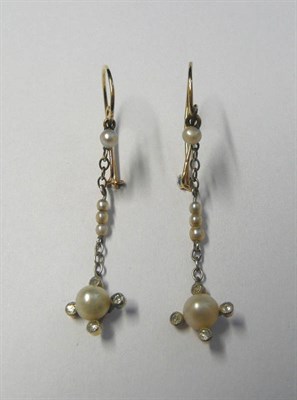 Lot 557 - A Pair of Edwardian Earrings, chain linked pearls to a pearl terminal within four diamonds,...