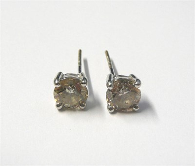 Lot 571 - A Pair of Diamond Solitaire Stud Earrings, round brilliant cut diamonds in white claw settings,...