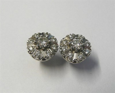 Lot 572 - A Pair of 18 Carat White Gold Diamond Cluster Earrings, the round brilliant cut diamonds in...