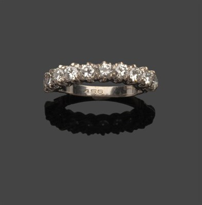 Lot 582 - A Diamond Half Hoop Ring, ten round brilliant cut diamonds in white claw settings to a fancy...