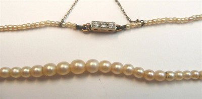 Lot 589 - A Graduated Pearl Necklace, strung to a diamond clasp, length 37cm   NB the pearls have not...