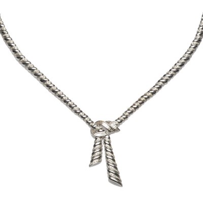 Lot 594 - A Diamond Necklace, alternating diamond set and plain polished links, joined at the centre by a...