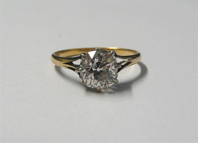 Lot 601 - A Diamond Solitaire Ring, the old cushion cut diamond held in an eight claw setting, to a...