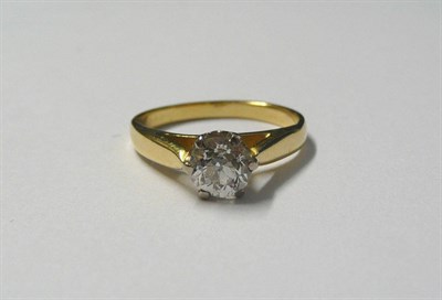 Lot 602 - A Diamond Solitaire Ring, the old cut diamond within a white six claw setting, to a yellow...