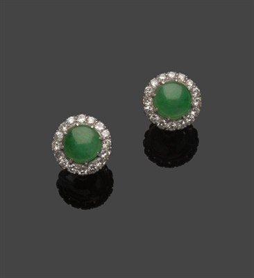 Lot 607 - A Pair of Jade and Diamond Cluster Earrings, a round cabochon jade within a border of round...