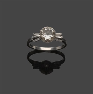 Lot 609 - A Diamond Solitaire Ring, an old cut diamond in a white six claw setting with fanned baguette...