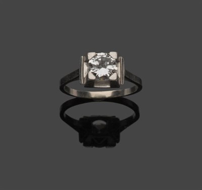 Lot 611 - A Diamond Solitaire Ring, the round brilliant cut diamond in a white four claw chunky setting,...