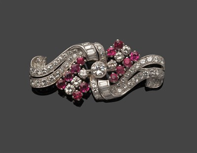 Lot 614 - A Diamond and Ruby Brooch, circa 1930, round brilliant cut and baguette cut diamonds, and brilliant