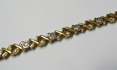 Lot 615 - An 18 Carat Gold Diamond Bracelet, round brilliant cut diamonds in white rubbed over settings,...