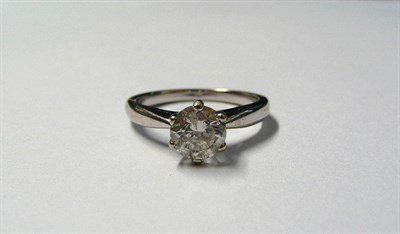 Lot 619 - A Diamond Solitaire Ring, the round brilliant cut diamond in a white six claw setting, to a tapered