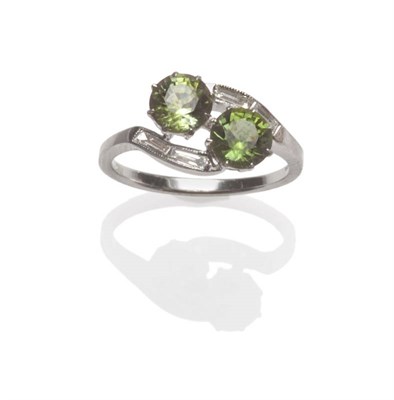 Lot 626 - An 18 Carat White Gold Green Tourmaline Ring, two round brilliant cut green tourmalines claw set on