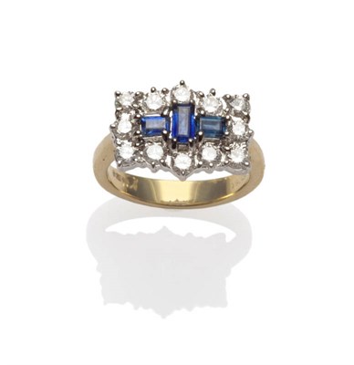 Lot 627 - An 18 Carat Gold Sapphire and Diamond Cluster Ring, a trio of step cut sapphires within a border of