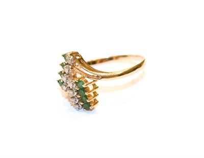 Lot 64 - An abstract emerald and diamond ring, stamped '585', finger size S