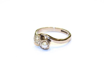 Lot 85 - A diamond and cultured pearl crossover ring, stamped '18CT' and 'PT', finger size I